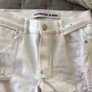 White EXPRESS JEANS ripped leg and frayed ankle. Size 4
